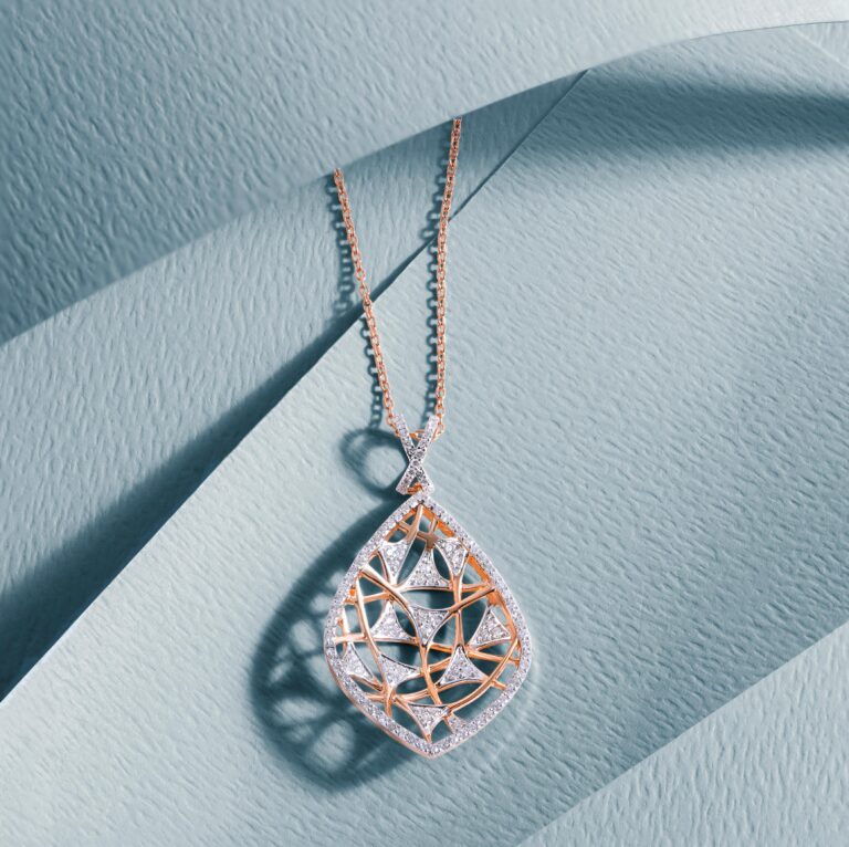 Luxurious diamond pendant with intricate design on a soft blue|Best Bridal Fancy Diamond Chain