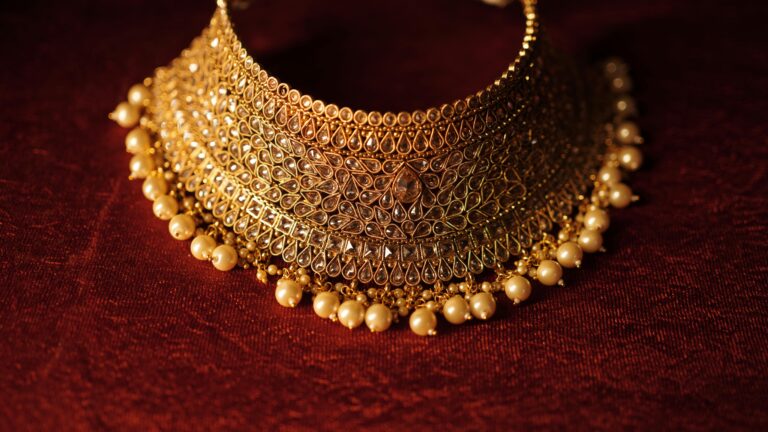 Elegant Fancy Gold Necklace with pearls on a rich red background|Best Bridal Necklace
