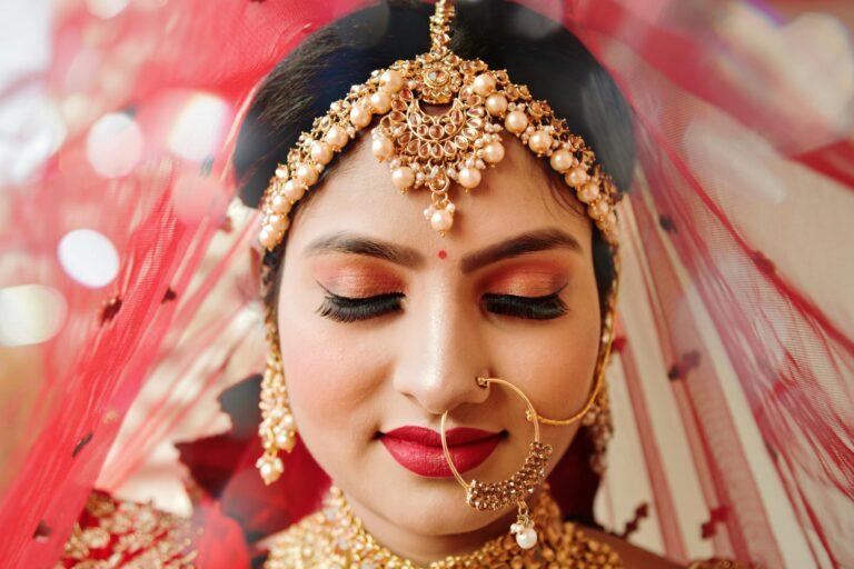 Bridal woman wearing traditional headpiece and nose ring jewellery|Best Head and Nose Jewellery